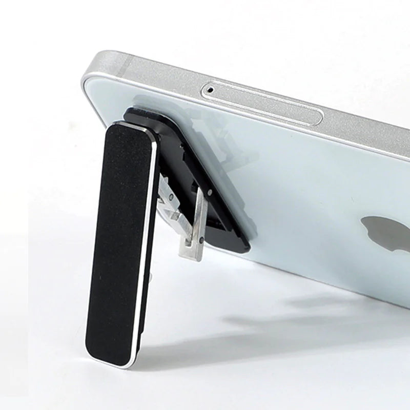 Ultra-Slim Aluminum Folding Phone Stand attached to a smartphone, showcasing its sleek design and adjustable functionality.