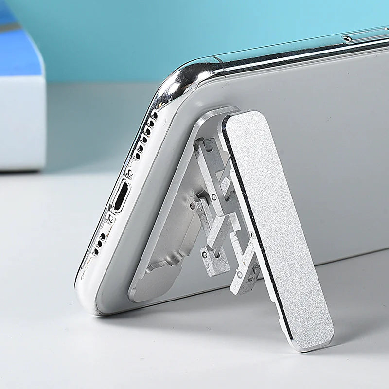 Ultra-slim aluminum folding phone stand supporting a smartphone, featuring a sleek design and durable construction.